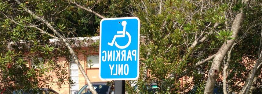 Handicap parking sign in parking lot